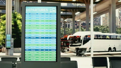 Contemporary coach station interior with empty seats and digital timetable Stock Footage 334728408
