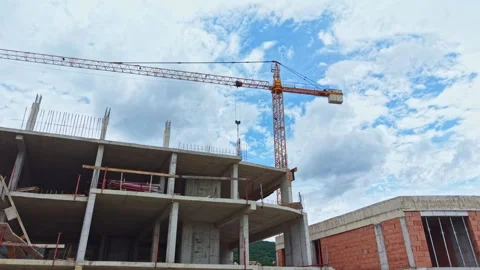 Contemporary construction on scaffolding. Skyscraper development with tall crane Stock Footage 340149812