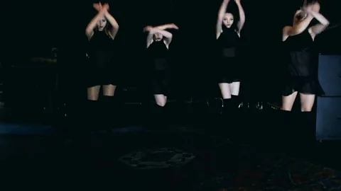 Contemporary dance performance of four dancers on dark Stock Footage 69224021