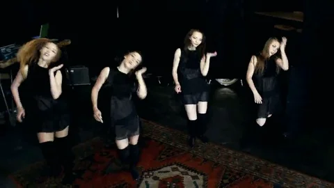 Contemporary dance performance of four dancers on dark Stock Footage 69224744
