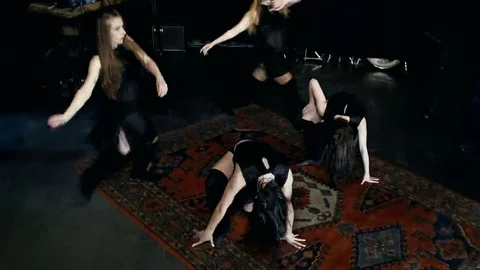 Contemporary dance performance of four dancers on dark Stock Footage 69224896