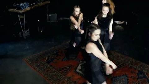 Contemporary dance performance of four dancers on dark Stock Footage 69224945
