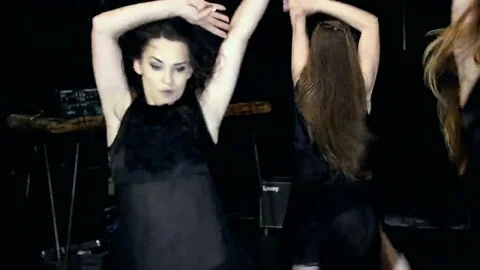 Contemporary dance performance of four dancers on dark Stock Footage 69225396