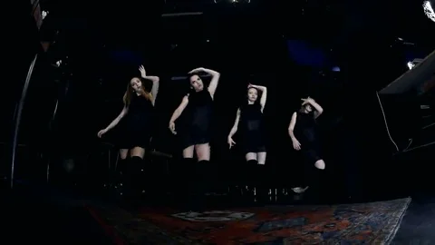 Contemporary dance performance of four dancers on dark Stock Footage 69225529