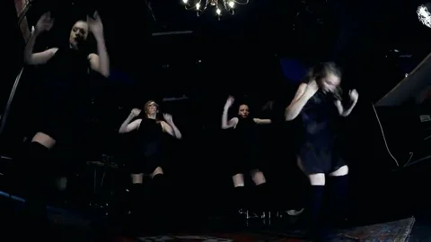 Contemporary dance performance of four dancers on dark Stock Footage 69225588