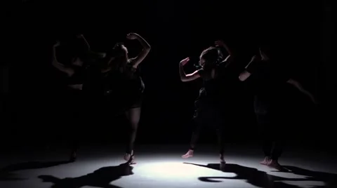 Contemporary dance performance of four talanted dancers on black, shadow, slow Stock Footage 61178965