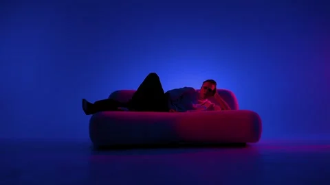 Contemporary dance pose on a sofa Stock Footage 345602553