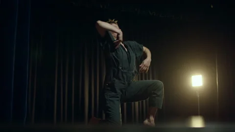 Contemporary Dancer practicing before a show alone in the theater Stock Footage 279813215