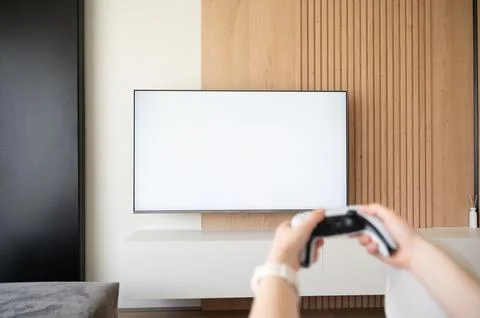 A contemporary gaming setup featuring a blank screen paired with a gaming c.. Stock Photos