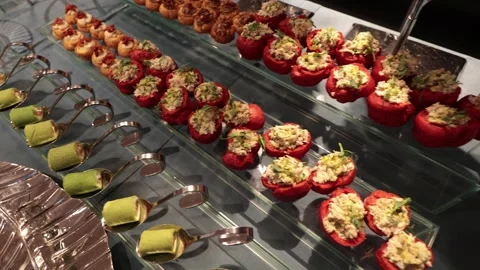A contemporary hotel dining area featuring a sleek buffet setup Stock Footage 296164056