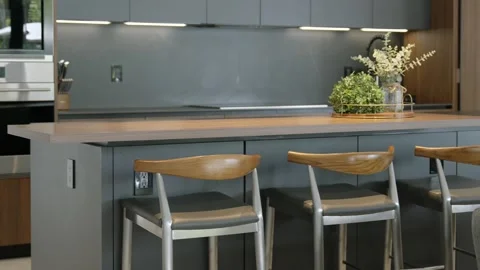 Contemporary kitchen interior with focus on kitchen island. Wooden countertop Stock Footage 282274609