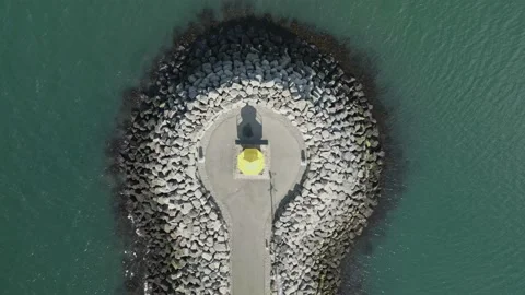 Contemporary lighthouse creating a lovely pattern seen from above Stock Footage 239619698