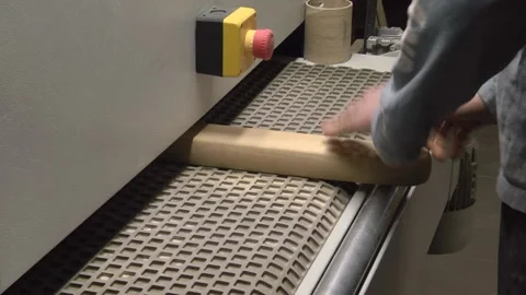 Contemporary machine tool used to process wooden boards and pile of planks in li Stock Footage 147078357