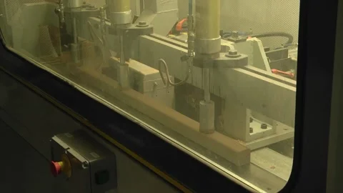 Contemporary machine tool used to process wooden boards and pile of planks in li Stock Footage 147078383