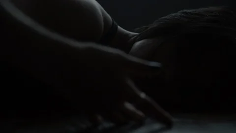 Contemporary modern dancer on floor dancing in dark moody dance studio 스톡 동영상 104268999