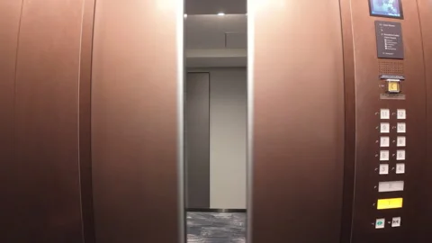 A contemporary modern elevator interior featuring open doors leading to Vídeos de archivo 295206224