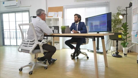 In a contemporary office, two senior executives with a mission to brainstorm Video stock 308990917