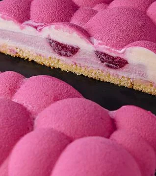Contemporary raspberry mousse cake close up Stock Photos