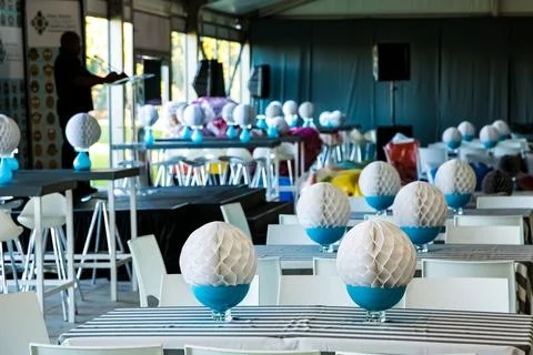 Contemporary restaurant setting with an array of tables set with decorative pape 写真素材