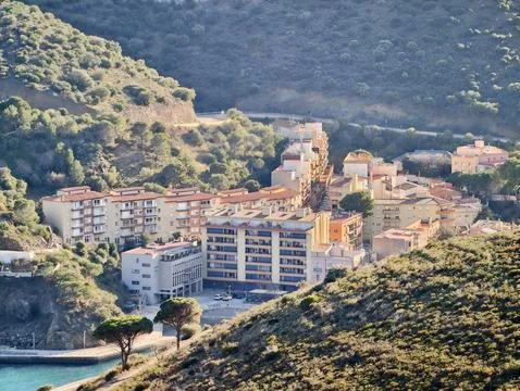 Contemporary Seaside Constructions Overlooking Quiet Bay With Terraces And Stock Photos