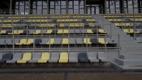 Contemporary Stadium Seating Featuring Striking Yellow and Gray Chairs for Stock Footage 313284706
