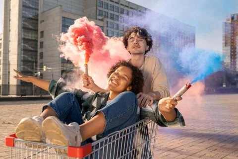 Contemporary teens with firecrackers having fun outside Stock Photos