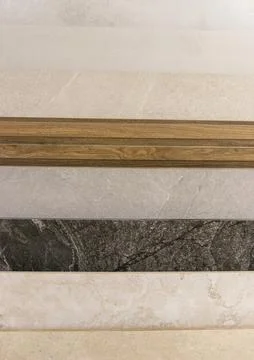 Contemporary Tile Selection Featuring Wood Accent Profiles and Marble Patte.. Stock Photos
