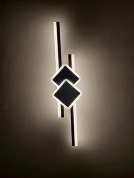 Contemporary Wall Sconce with Intersecting Square and Bar Design Stock Photos