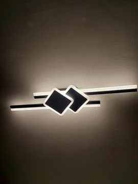 Contemporary Wall Sconce with Intersecting Square and Bar Design Stock Photos