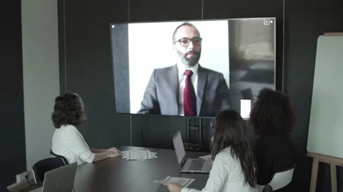 Content bearded CEO video chatting with partners and talking Stock-Footage 137510944