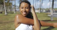 Content Black Girl Stretching Hands In Park Stock Footage
