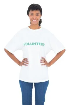 Content black haired volunteer posing with hands on the hips 스톡 사진
