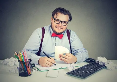 Content chunky man at workplace Stock Photos