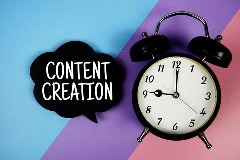 Content Creation text on speech bubble with alarm clock top view on  blue, .. Stock Photos