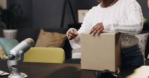 Content creator, box and hands of woman in home for recording, unboxing and.. Stock Photos