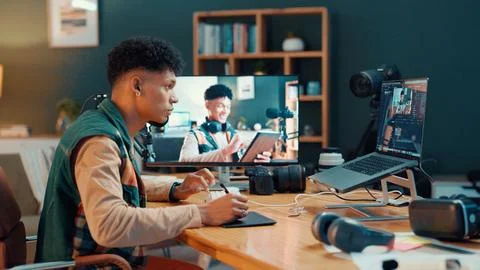 Content creator, computer screen and man editing video on graphic tablet to Fotos de archivo