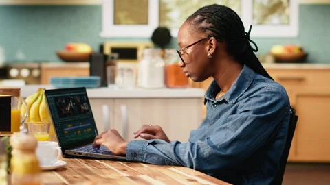 Content creator editing with color grading, video montage on laptop Stock Footage 344246333