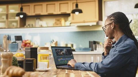 Content creator editing with color grading, video montage on laptop Stock Photos