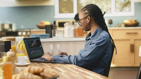 Content creator editing with color grading, video montage on laptop Stock Photos