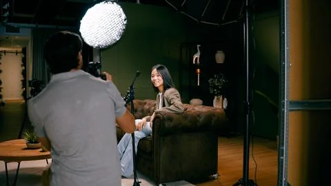 Content creator filming interview for podcast production Stock Photos