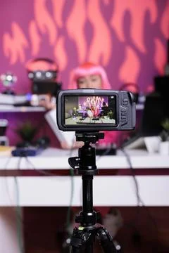 Content creator filming white box review in recording studio talking with Stock Photos