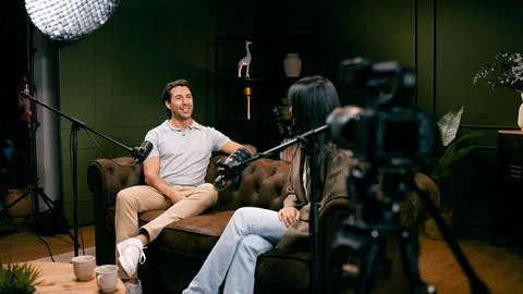 Content creator interviewing guest for podcast video production Stock Photos