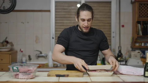 Content creator introducing new video of meat preparation for his cooking Stock Footage 205316054
