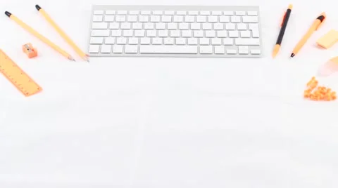 Content Creator Orange stationary keyboard styled desktop flatlay Stock Footage 68709937