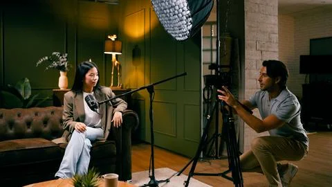 Content creator recording podcast interview in studio Stock Photos