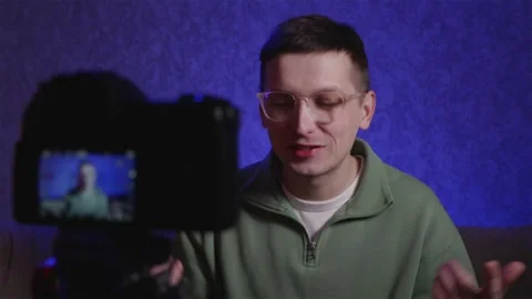 Content creator recording a vlog at home studio Stock Footage 333756941