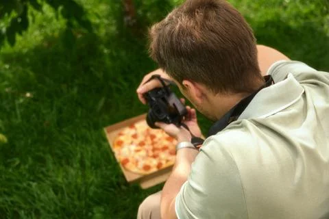 Content creator shooting trendy breakfast pizza for morning social media blog Stock Photos