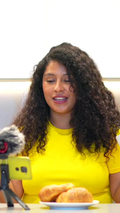 Content creator streaming online while having breakfast at home Stock Footage 277790626