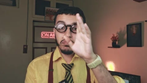 Content Creator Taking Notes on Camera, Warm Cinematic Lighting Stock Footage 318593175