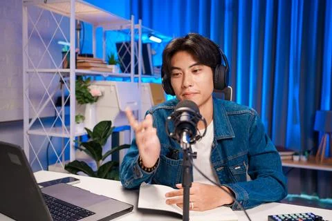 Content creator talking and pointing during podcast Stock Photos